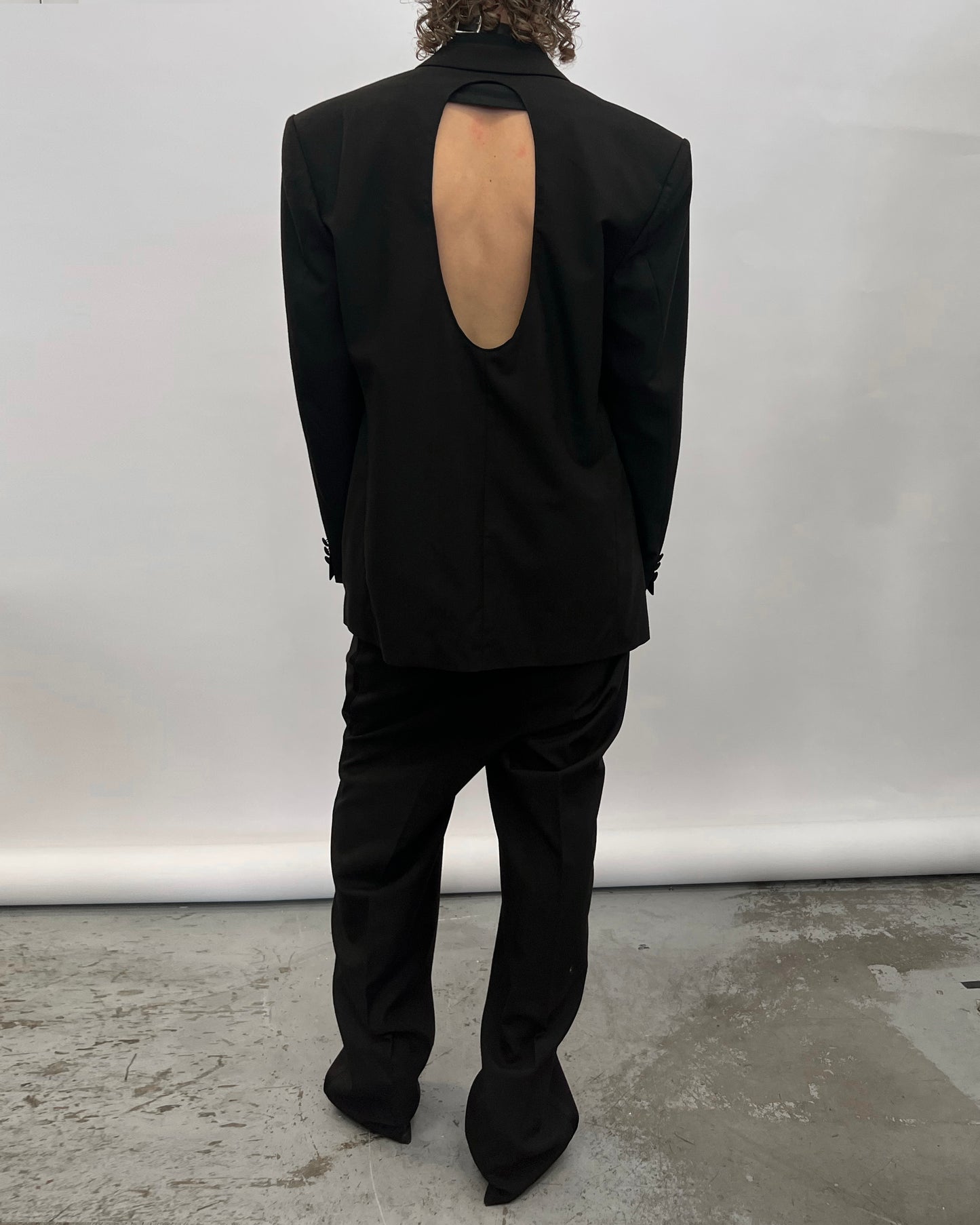 Blazer with hole in the back.